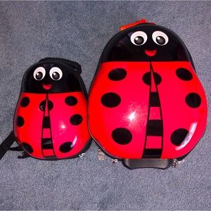 Red Ladybug matching suitcase and backpack